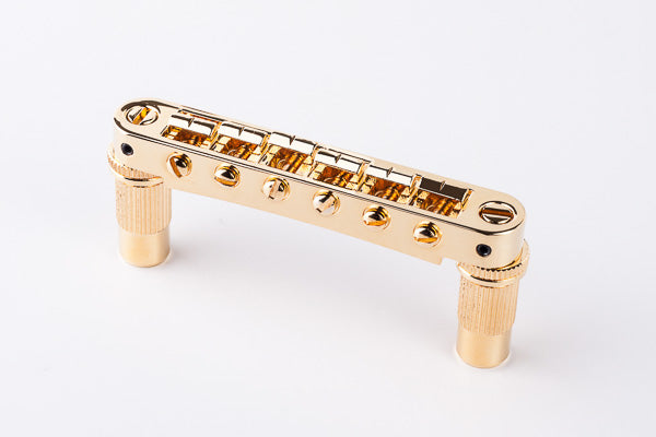 TonePros Bridge - Aluminium Metric pre-notched, bell brass saddles Metric thread - Gold